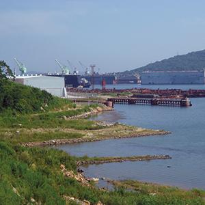 The waterfront at Chazma Bay, 45 km southeast of Vladivostok. Derelict submarines lie here, rotting in the water. Photo credit: Sergey Tymchenko / wikimapia.org